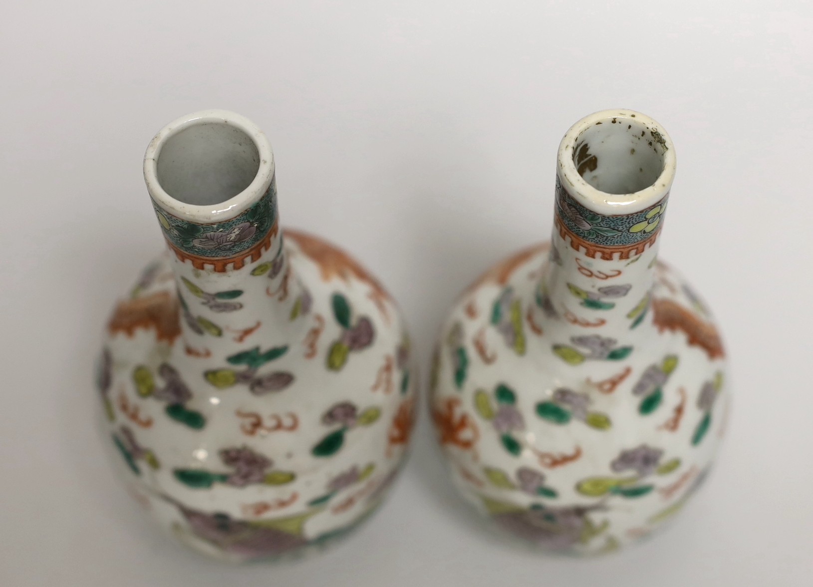 A pair of Chinese enamelled porcelain ‘dragon’ bottle vases, Kangxi marks probably Guangxu period, 15cms high (a.f.)